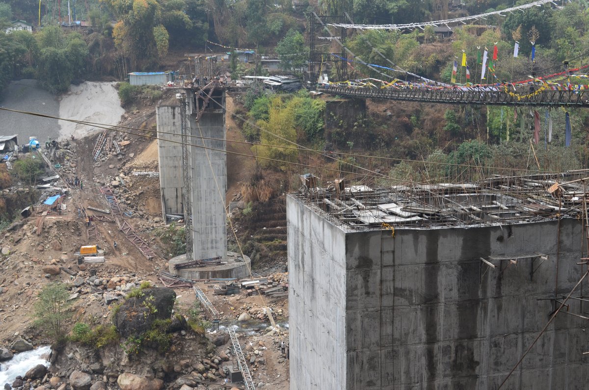 Bakcha Khola Bridge — Piers and prayer flags over gorge