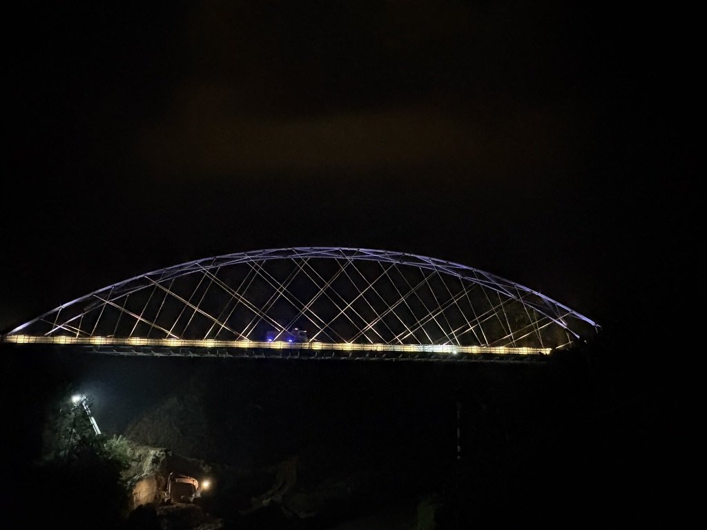 Tlawng / Faith Bridge — Night view with illuminated arch